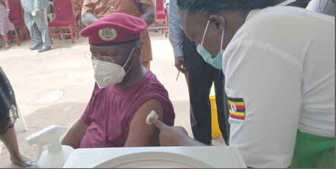 The Commissioner General of Uganda Prisons Byabashaijja being vacinated of Covid19