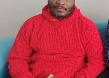 Lumbuye with overgrown beards soon after his release from from a Turkish detention