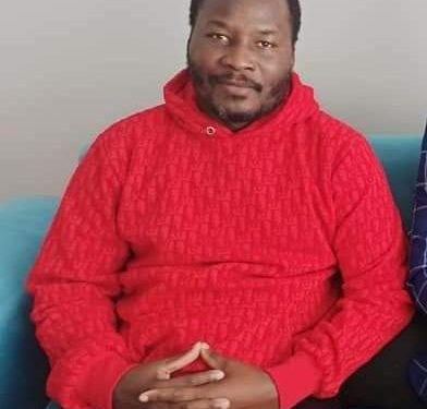 Lumbuye with overgrown beards soon after his release from from a Turkish detention