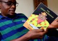 Kakwenza holds his controversila book-The Barbarian.