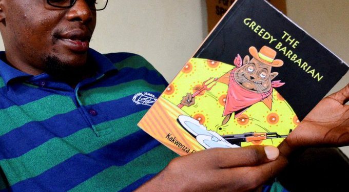 Kakwenza holds his controversila book-The Barbarian.