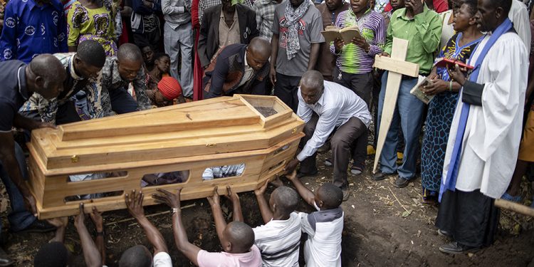 Families bury their dead after Kasese School massacre