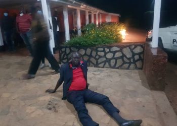 The Chief magistrate of Kapchorwa court, Godfrey Teko who is also the son of State minister Peter Lokeris sits on the ground after he was arrested.